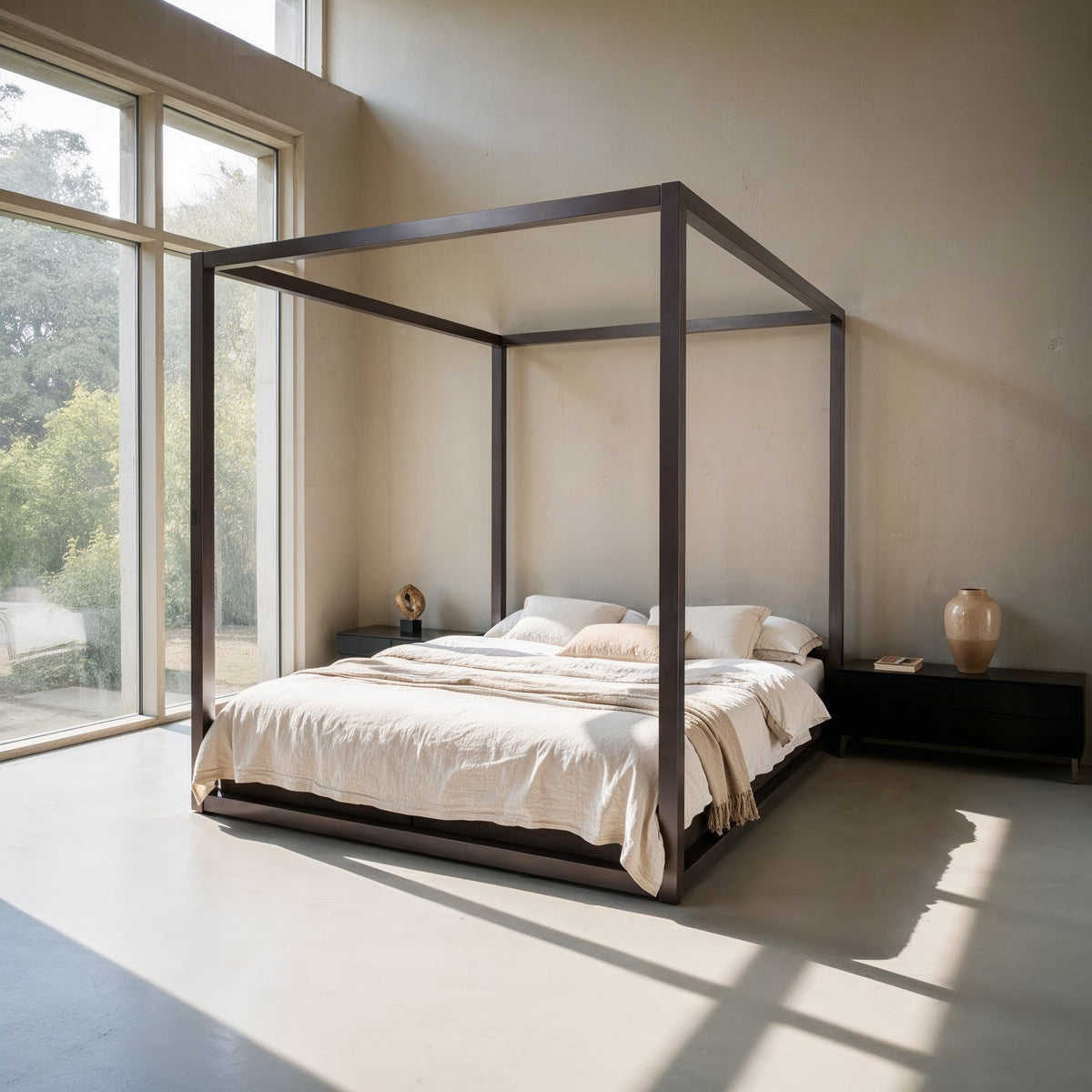 The Loft canopy bed without headboard with dark square frame, angled view by tall windows