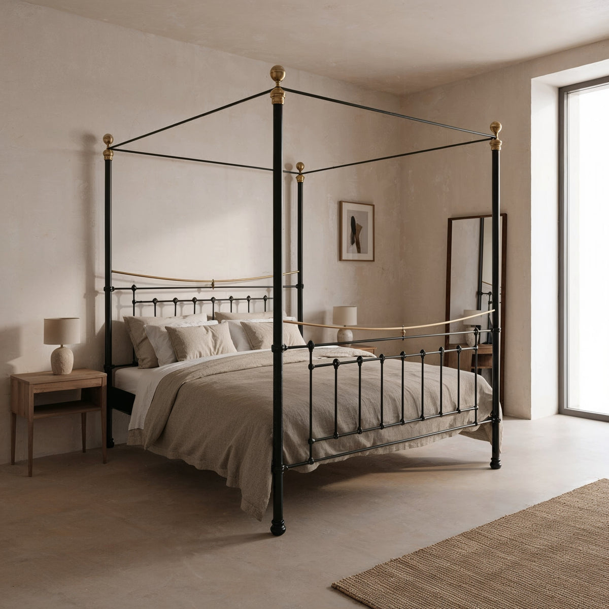 Durham canopy bed showroom model 180x200cm in black with brass knobs and spindles, angled front view in a light bedroom