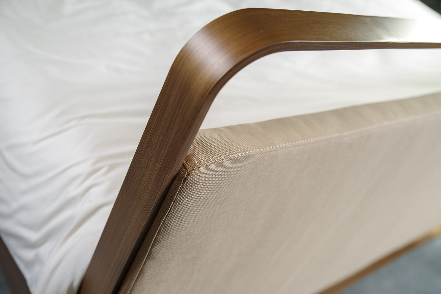 Detail curved metal frame of bed Milano with high-quality finish