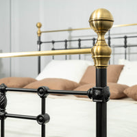 Gold decorative finial of metal bed Sandhurst with classic shapes