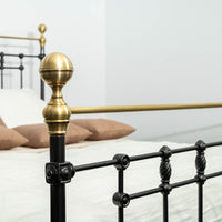 Detail polished brass tube of bed Sandhurst with black metal joints