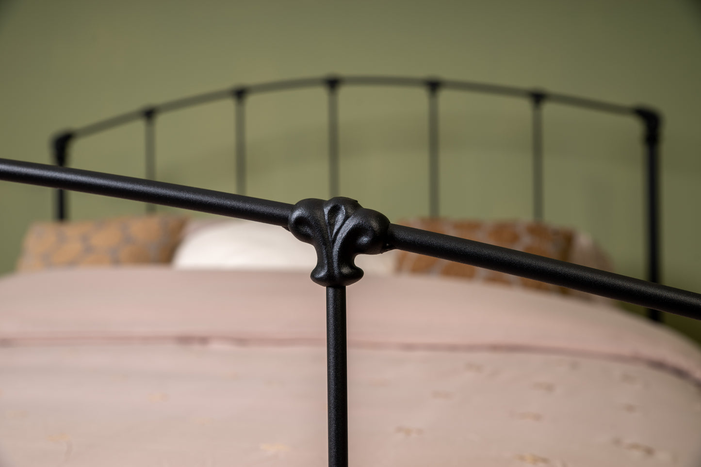 Close-up decorative connecting button of metal bed Stavelot with black matte finish