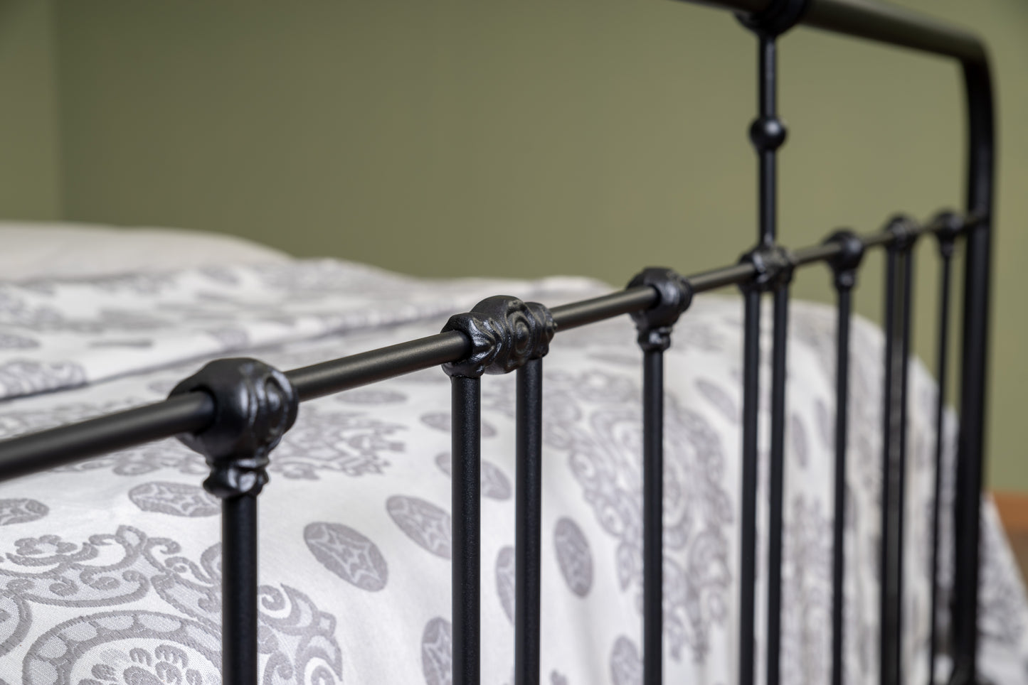 Detail decorative bar joints of matte black metal bed Veurne