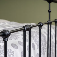 Detail decorative bar joints of matte black metal bed Veurne