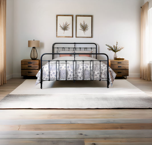 Front view classic metal bed Veurne in matte black with decorative bars and decorative headboard in country bedroom