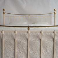 Close-up bars and gold arch metal bed Wellington